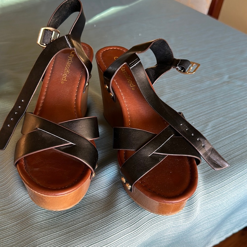 Black wedge sandals. Only worn once.size 7 1/2